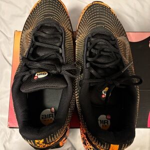 Nike Black Sneakers with Orange Accents